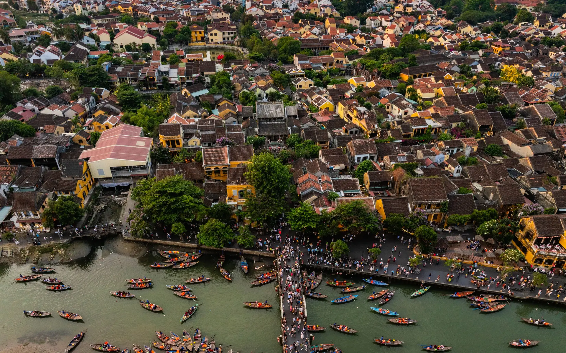 Hoi An from above at sunset: the town, the river and its boats